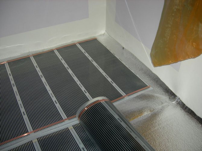 Installation de chauffage par le sol infrarouge